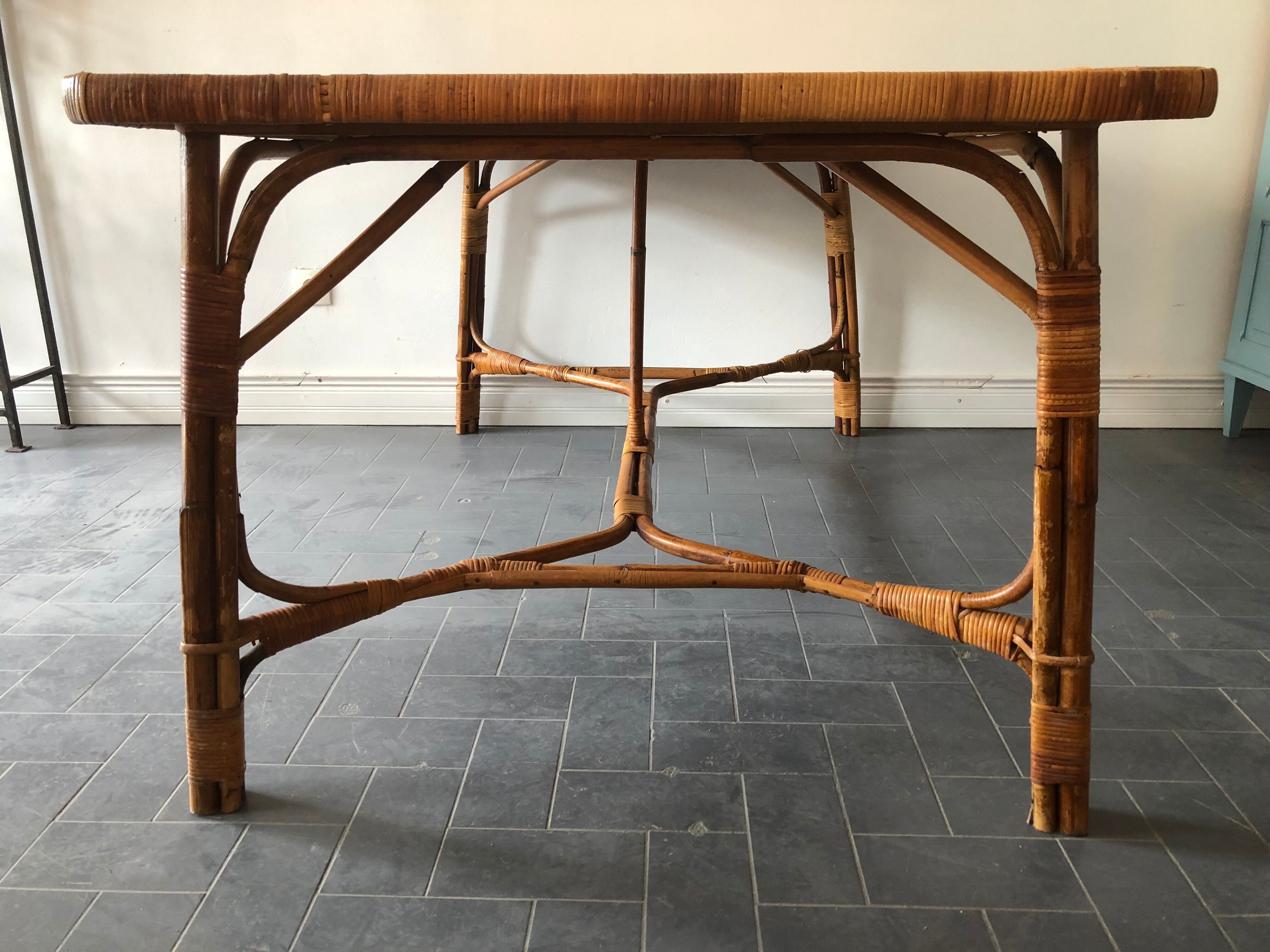 Vintage rattan table 6 people by Louis Sognot