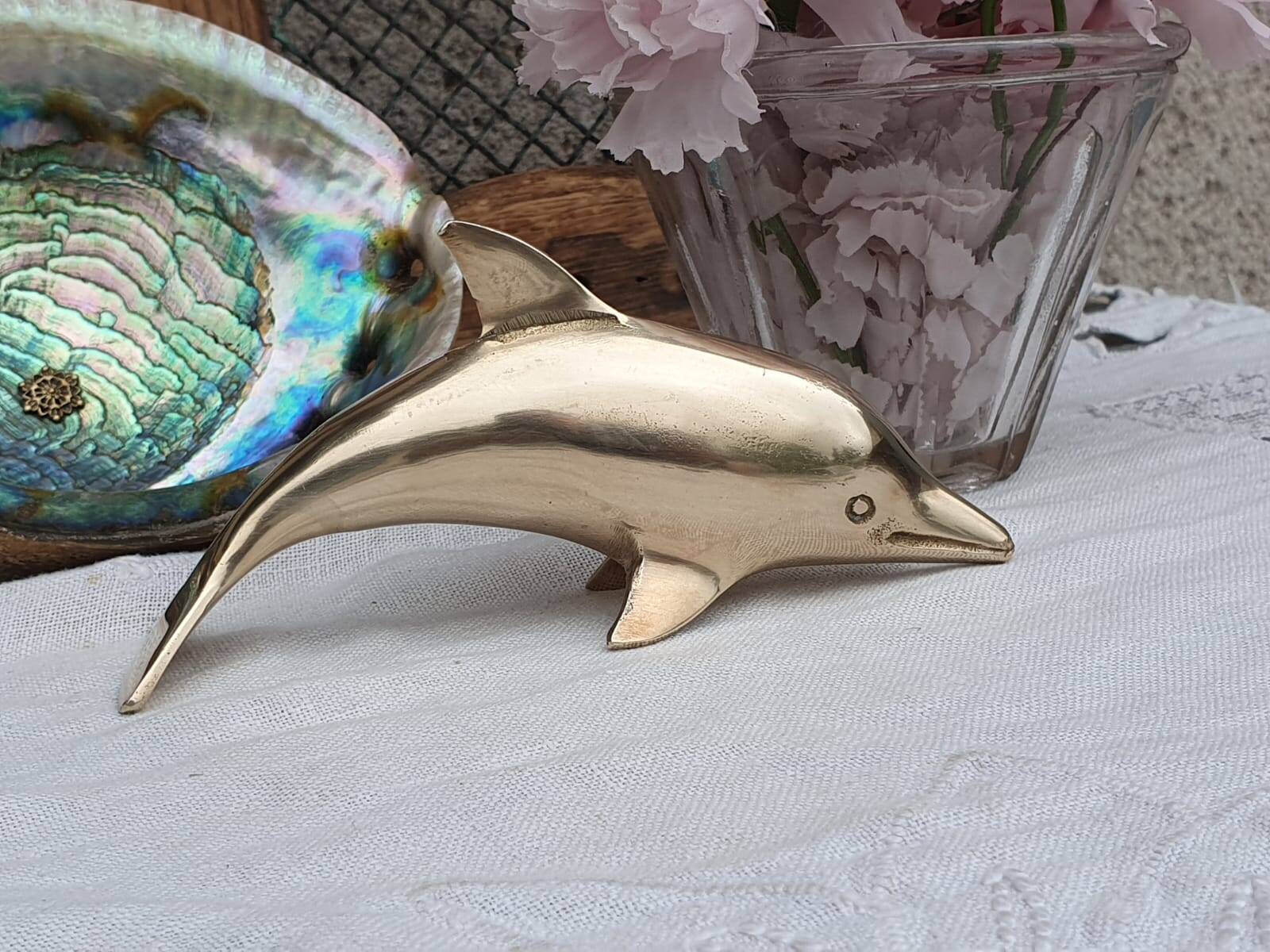 brass dolphin
