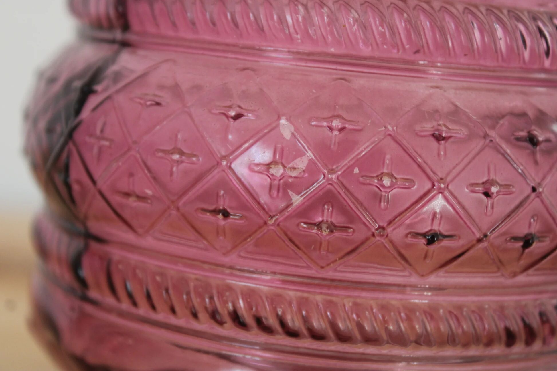 Vintage pink pressed glass carafe – retro decorative bottle with wooden stopper.