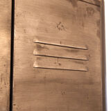 Industrial metal cloakroom with rounded corners.