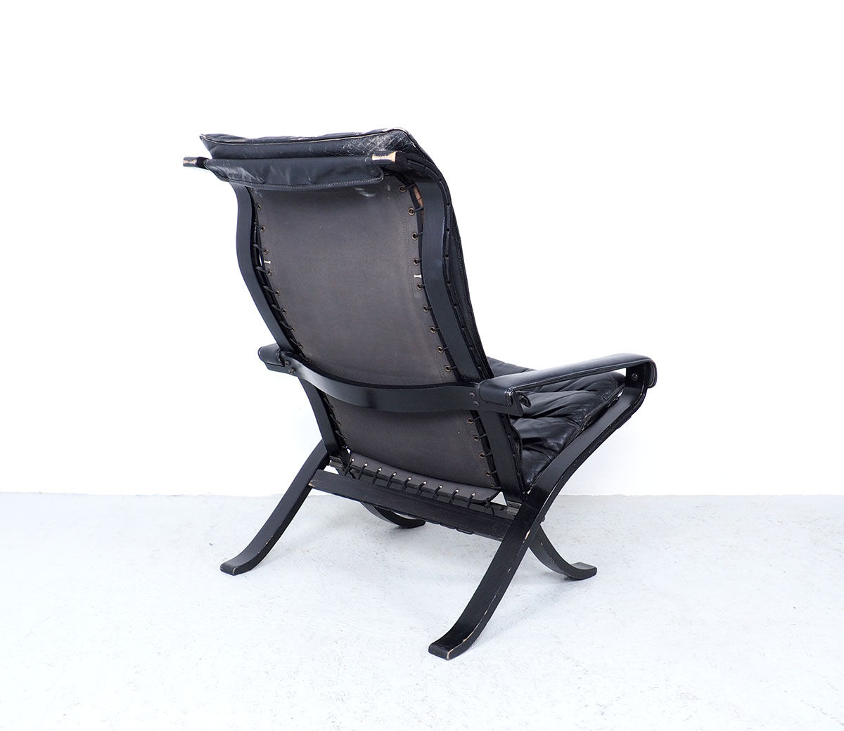 Westnofa black leather Flex armchair with ottoman