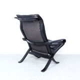 Westnofa black leather Flex armchair with ottoman