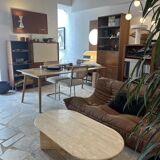 Oval coffee table in raw travertine