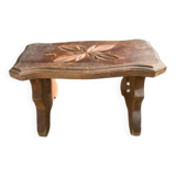Bench in carved and varnished wood, mountain chalet decoration, old