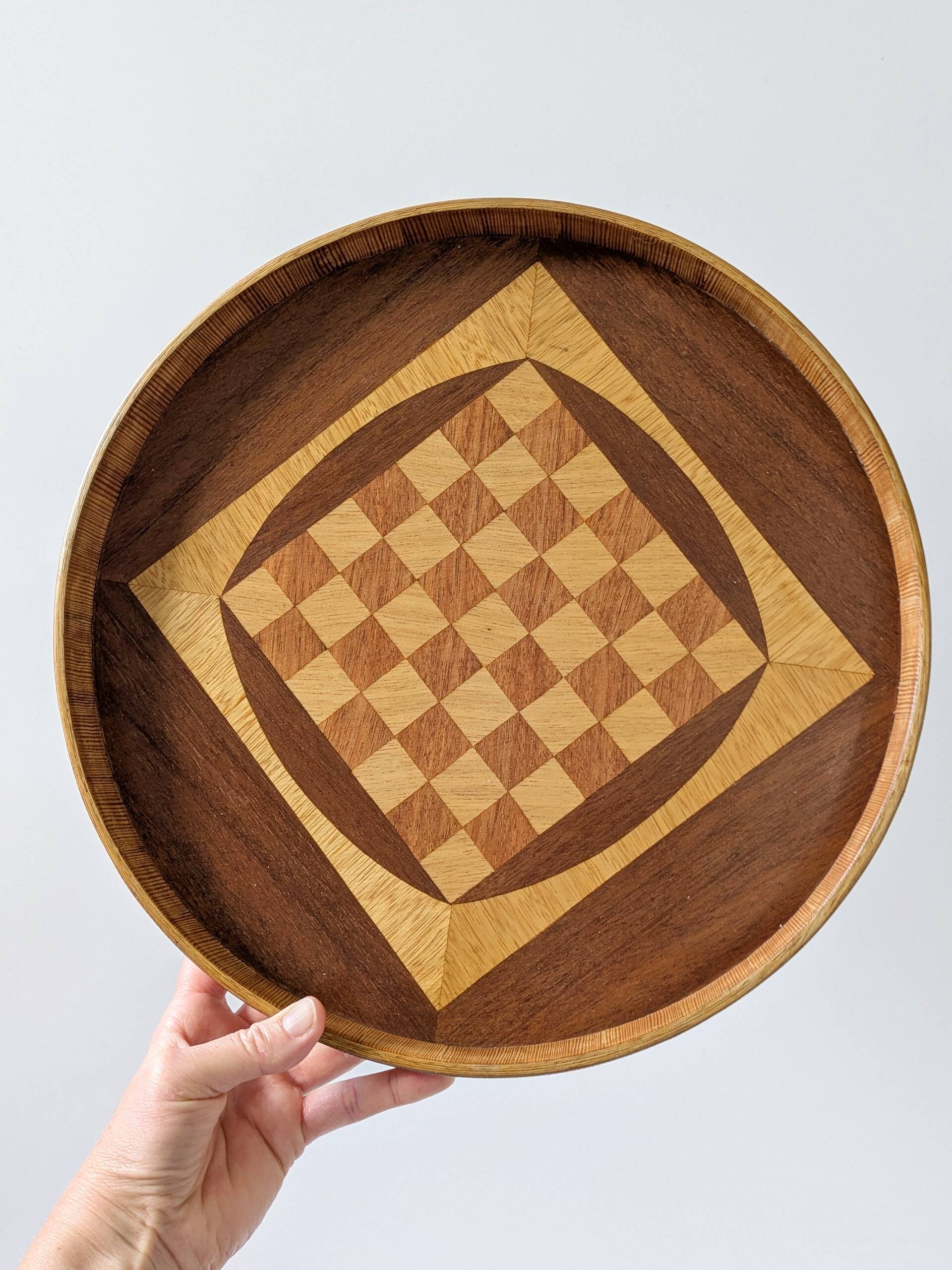 Round checkered tray in marquetry wood, vintage design from the 60s