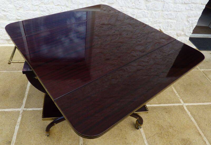 Chic serving table on wheels from the 60s with brass decorations and two shelves.