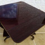 Chic serving table on wheels from the 60s with brass decorations and two shelves.