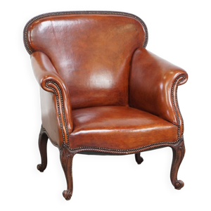 Fauteuil ancien en peau