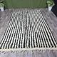 Handwoven traditional black and white Berber rug, size 250/150 cm.