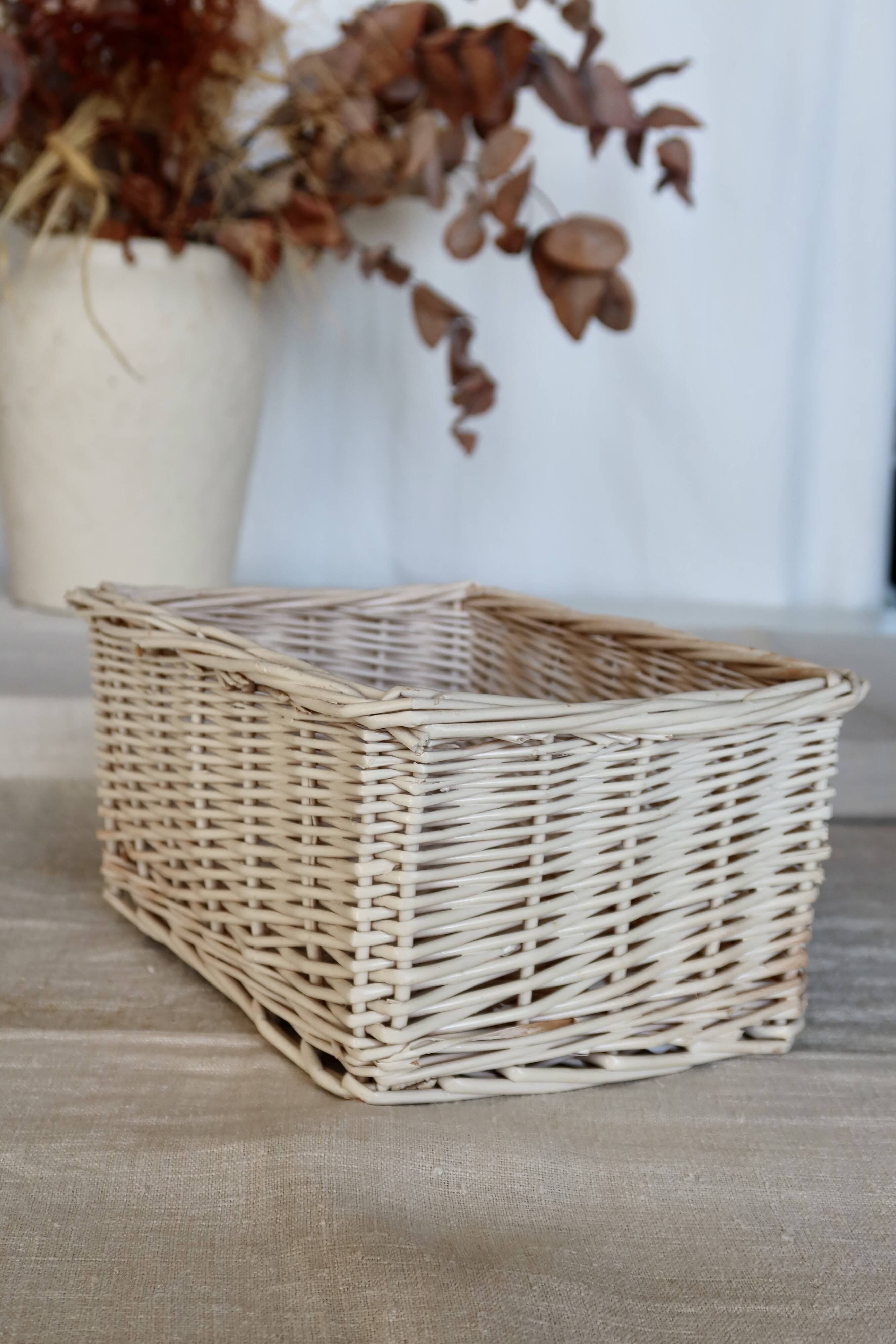 Vintage white wicker storage baskets