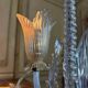 Asymmetrical Venetian chandelier in colourless and gold Murano glass, circa 1980.