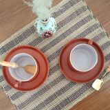 terracotta cups with saucers