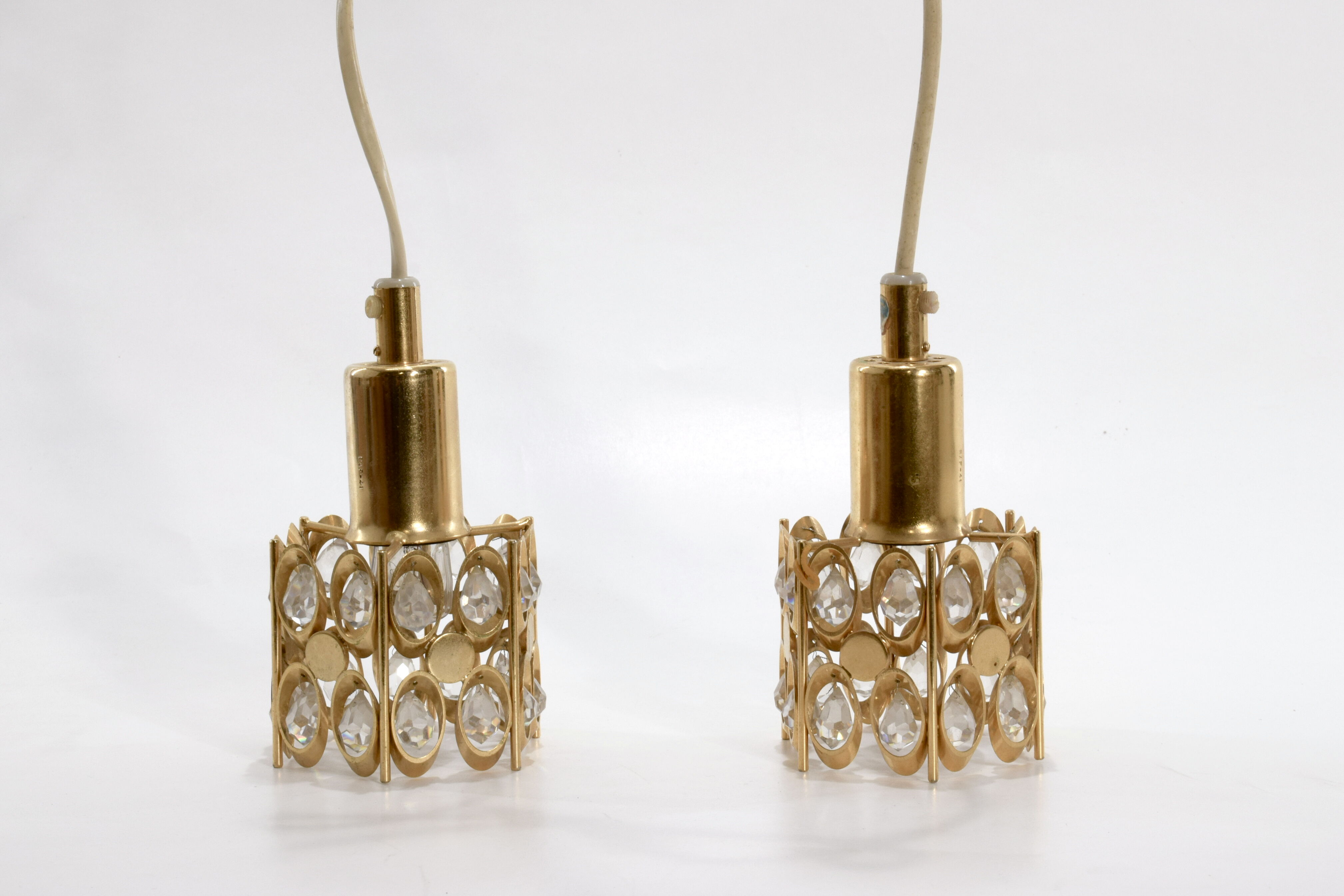 Two pendant lights in gilded brass and crystal, by Palwa, design 1960
