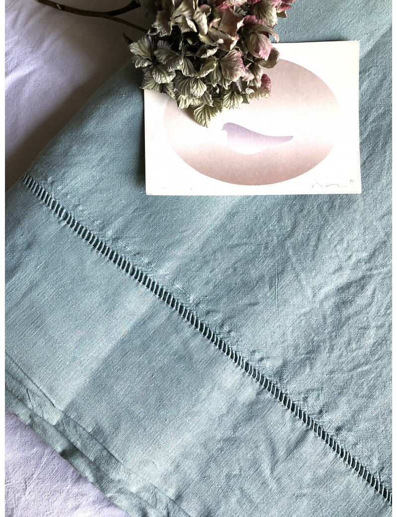 Old sheet in pure washed linen tinted in celadon green