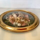 Golden oval frame dried flowers