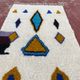 Moroccan Berber rug in cream and blue 250x150 cm – colourful geometric patterns