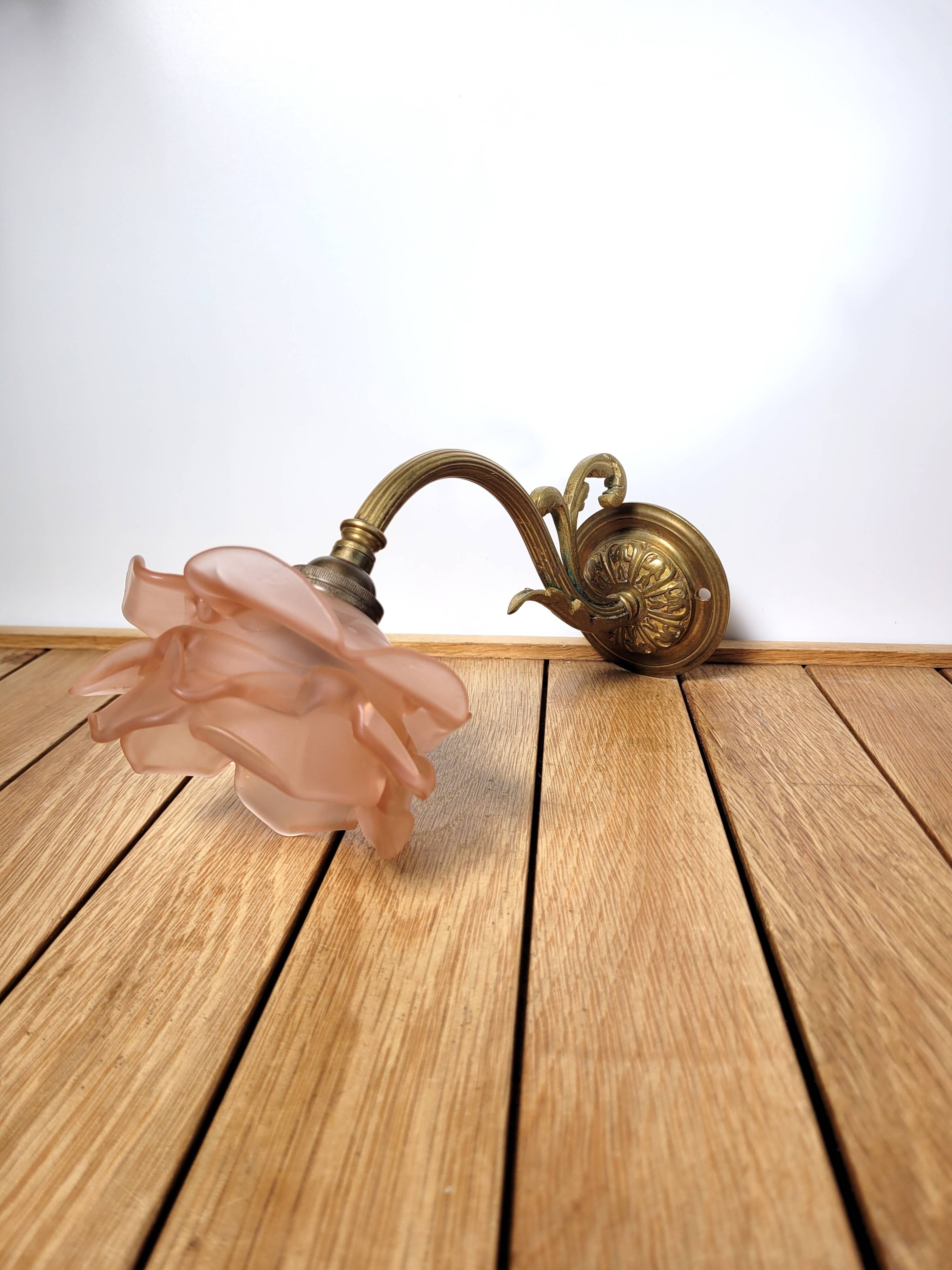 Old pink and golden brass wall lamp