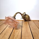 Old pink and golden brass wall lamp