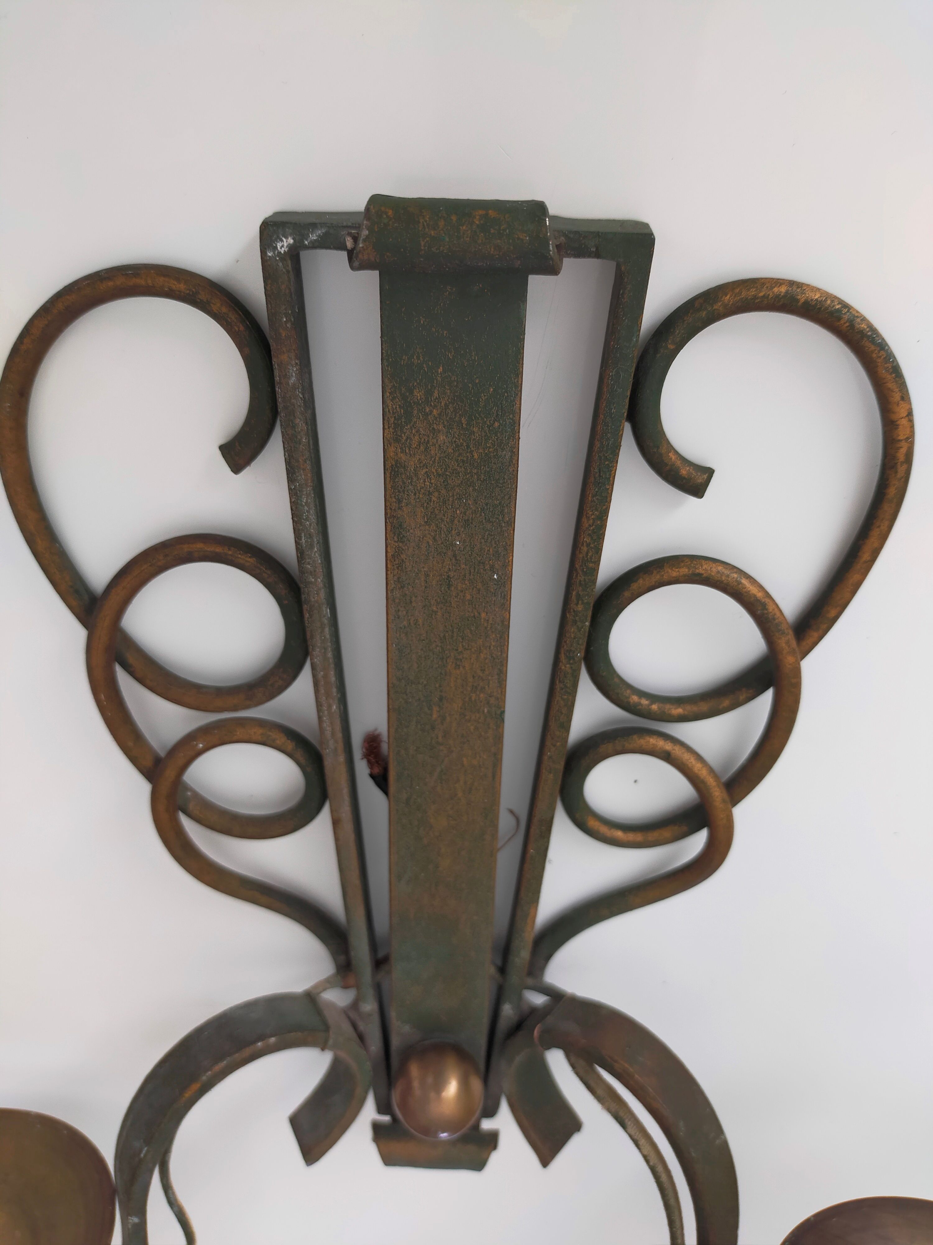 Pairs of vintage wrought iron wall lamps