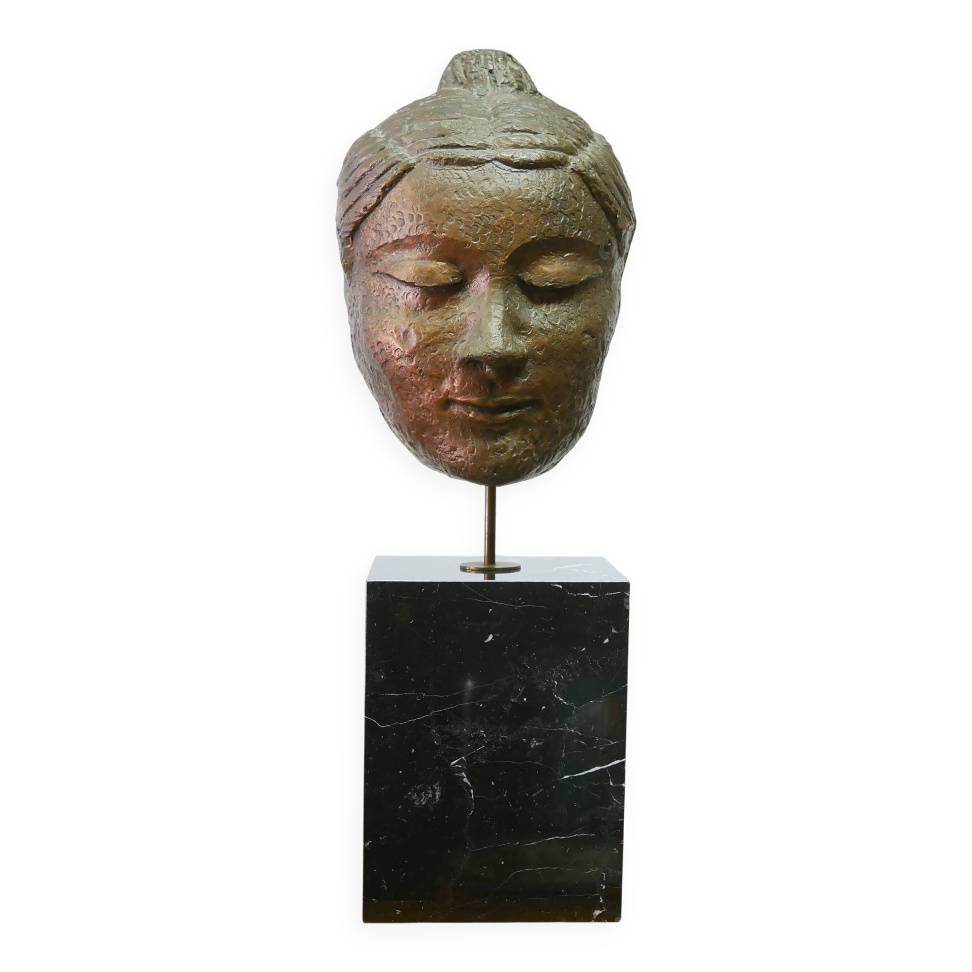 Buddha head sculpture, marble base