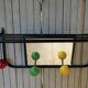 Vintage wall coat holder with 4 coloured balls, mirror and shelf