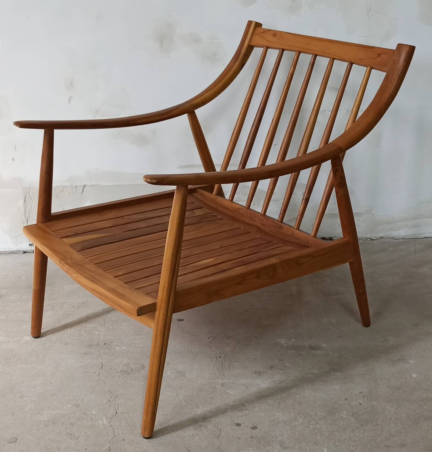 Pair of cozy teak armchairs with cushions