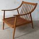 Pair of cozy teak armchairs with cushions