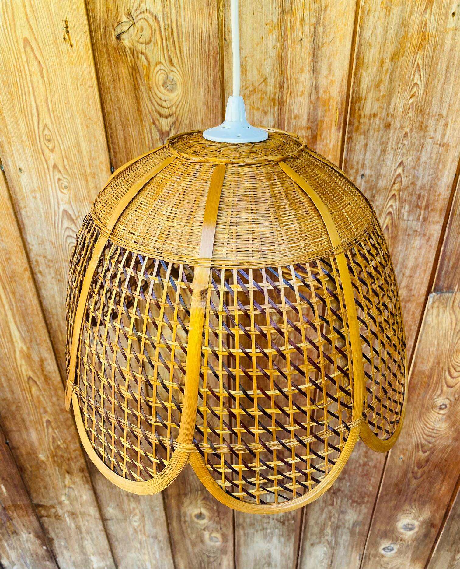 Rattan and cane lampshade in the shape of a flower from the 1970s.