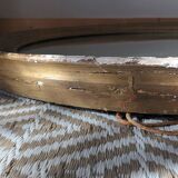 Antique oval gilded stucco mirror