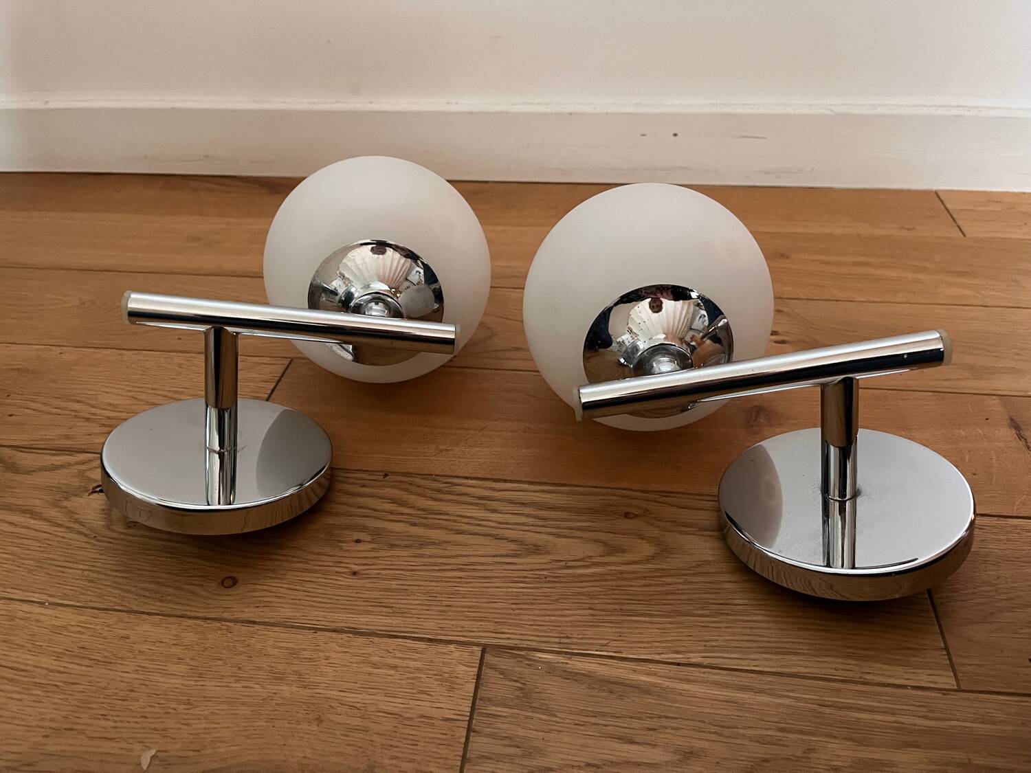 Pair of metal and opaline wall lights