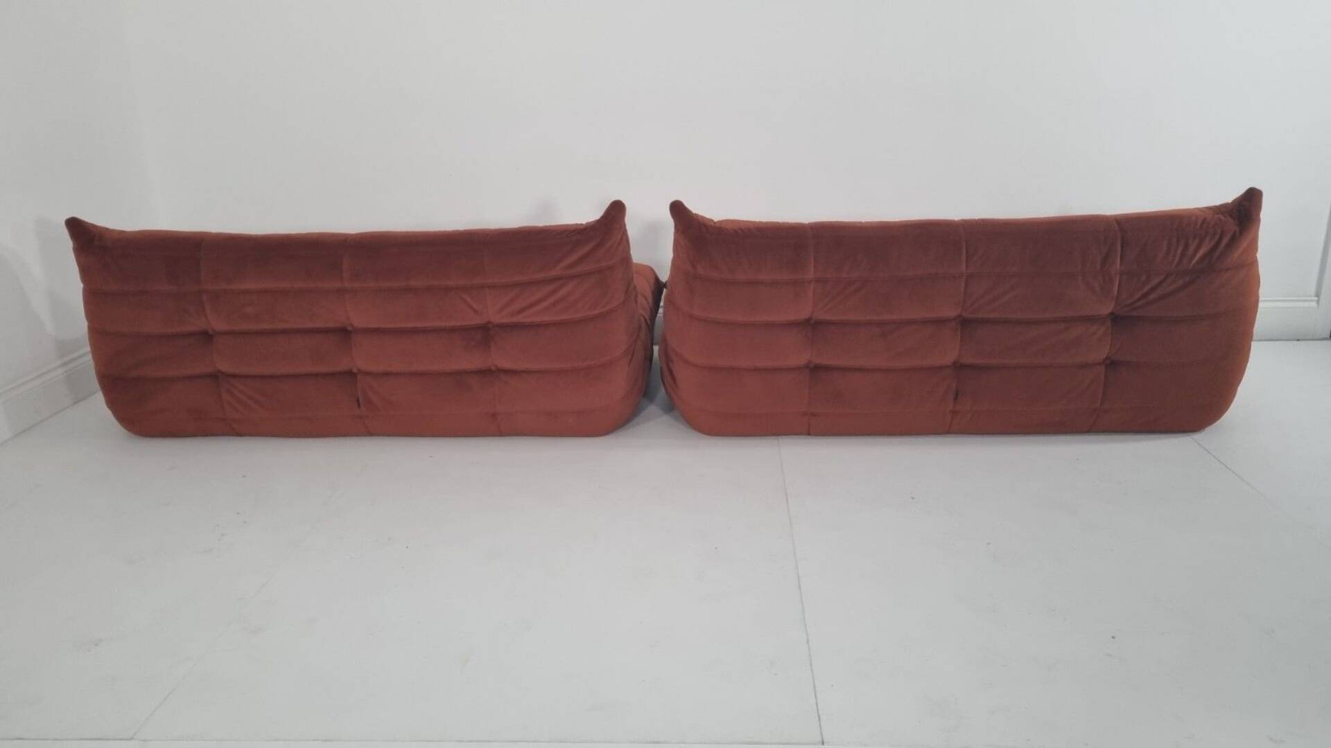 Ligne Roset Pair of 3-seater Togo sofas in rust velvet