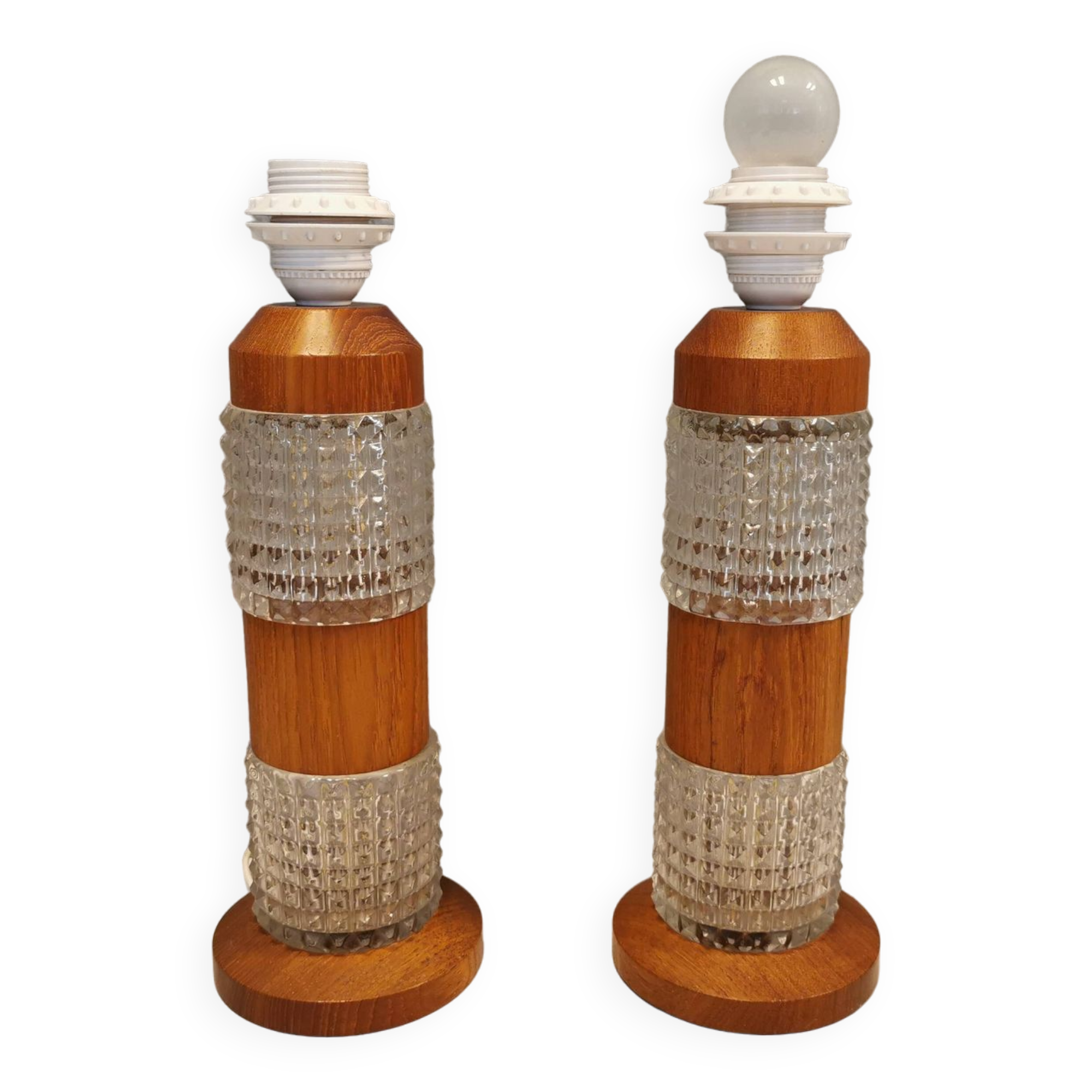 Swedish table lamps made of teak wood and hard pressed crystal glass.