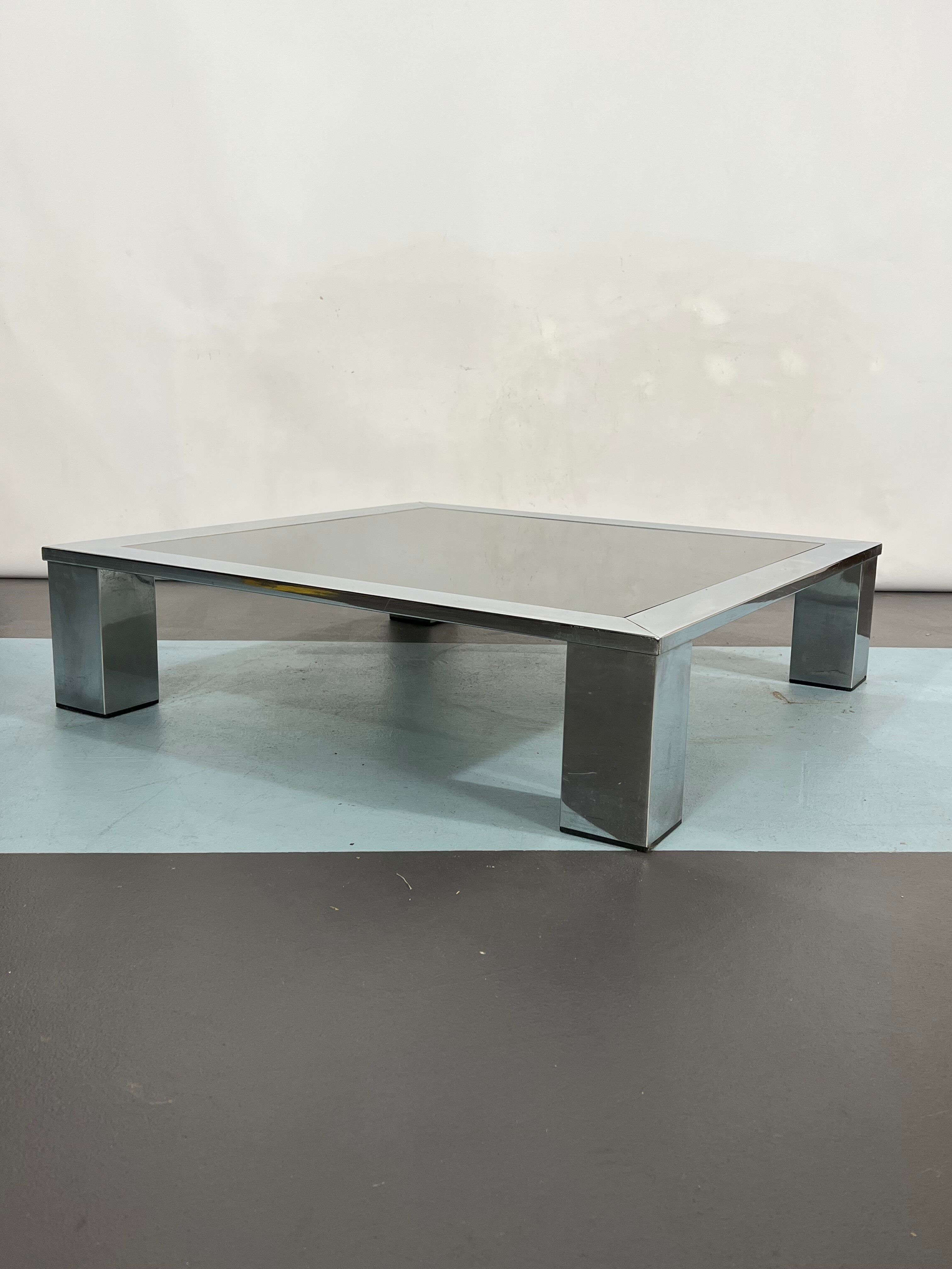 Mid-century chrome and dark mirror glass side table attributed to Saporiti. Italy 1970s
