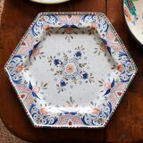 Ancient hexagonal plate in earthenware with polychrome floral decoration.