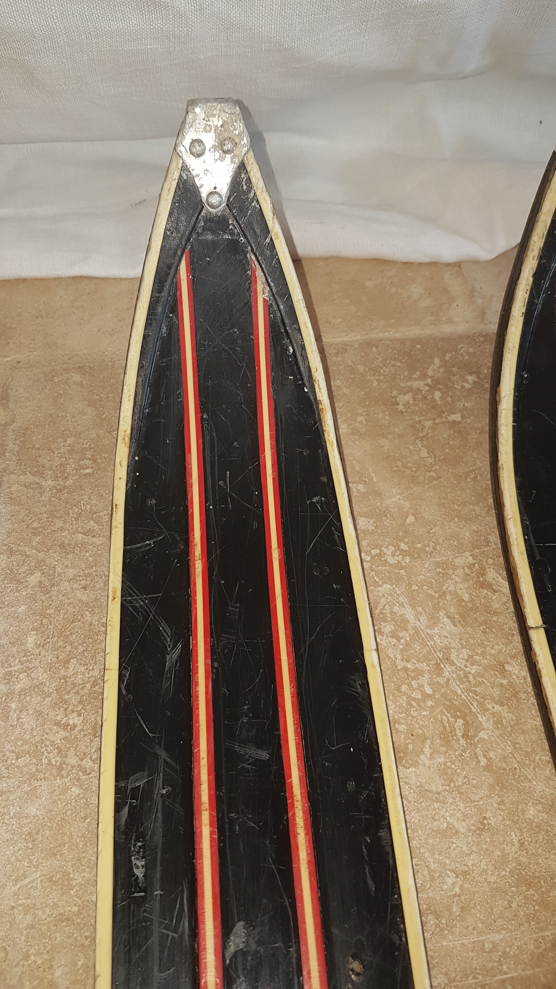 Old skis wooden and its pair of sticks