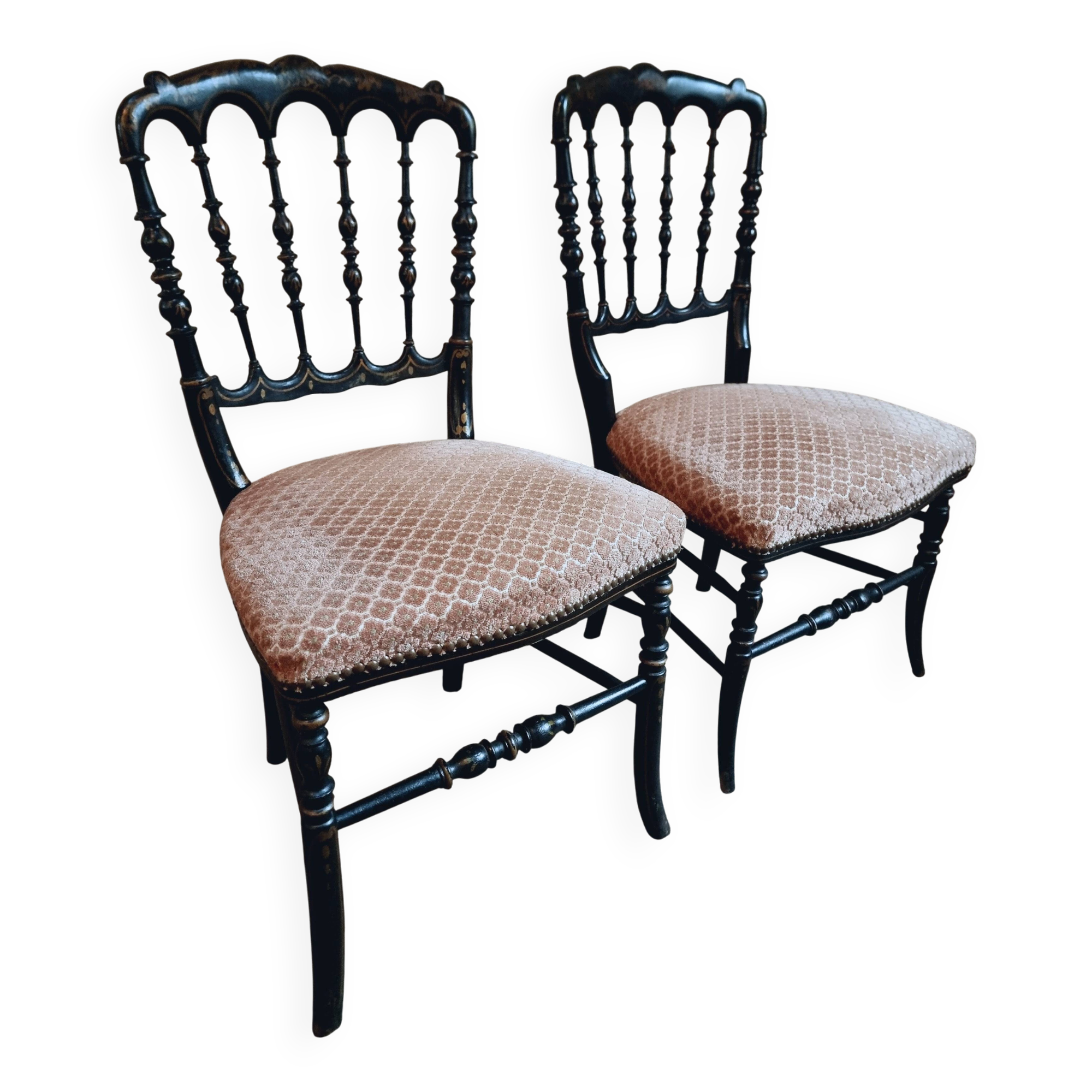 Pair of antique Napoleon III chairs in blackened wood and fabric.