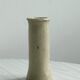 Minimalist beige ceramic vase.