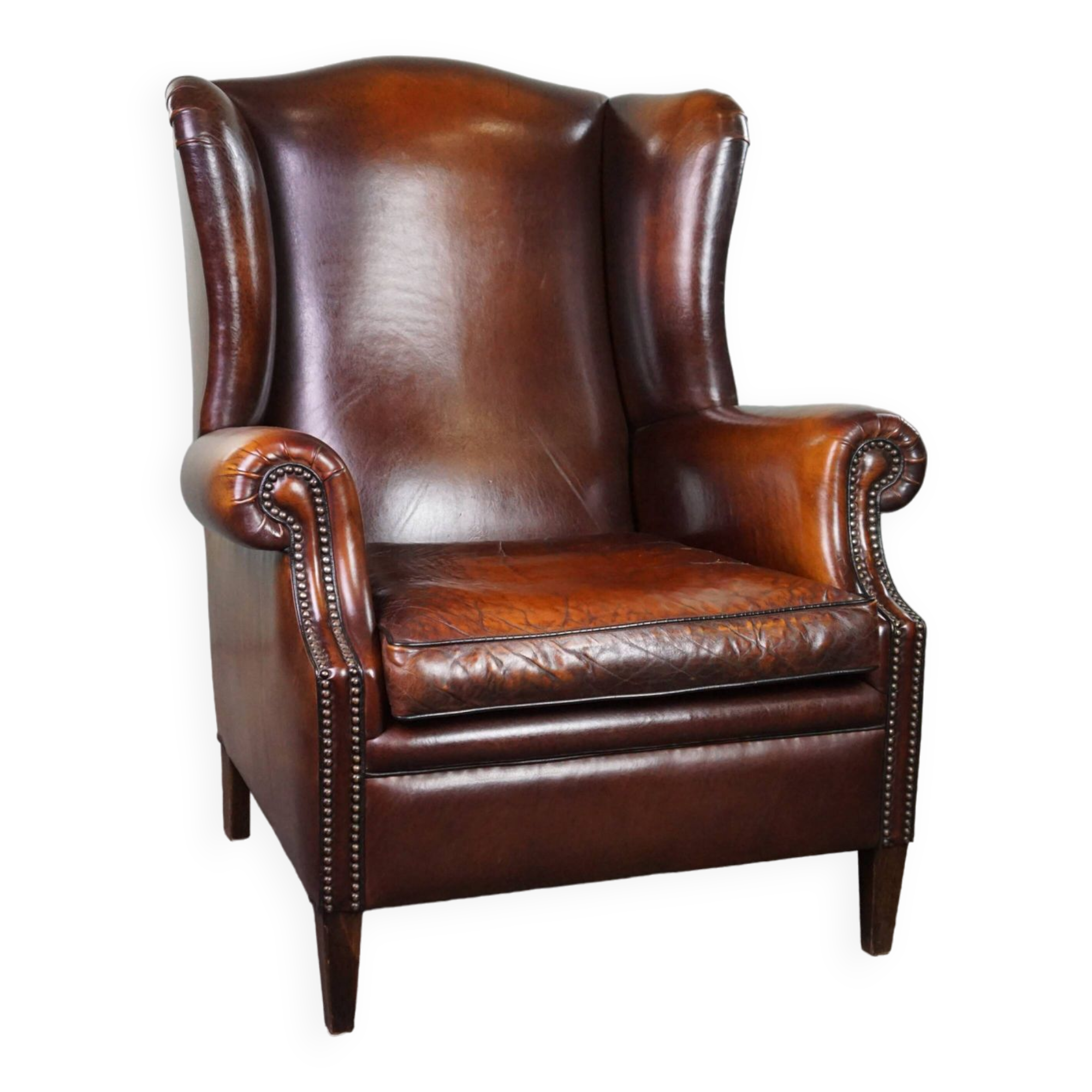 Luxurious large sheep leather wingback armchair with beautiful colors and amazing patina