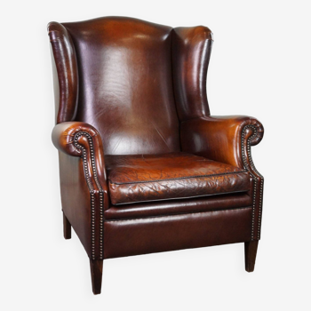 Luxurious large sheep leather wingback armchair with beautiful colors and amazing patina