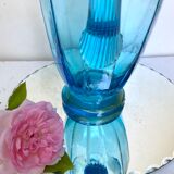 Old pitcher in blue glass