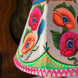 Sandstone foot accent lamp surmounted by a painted lampshade