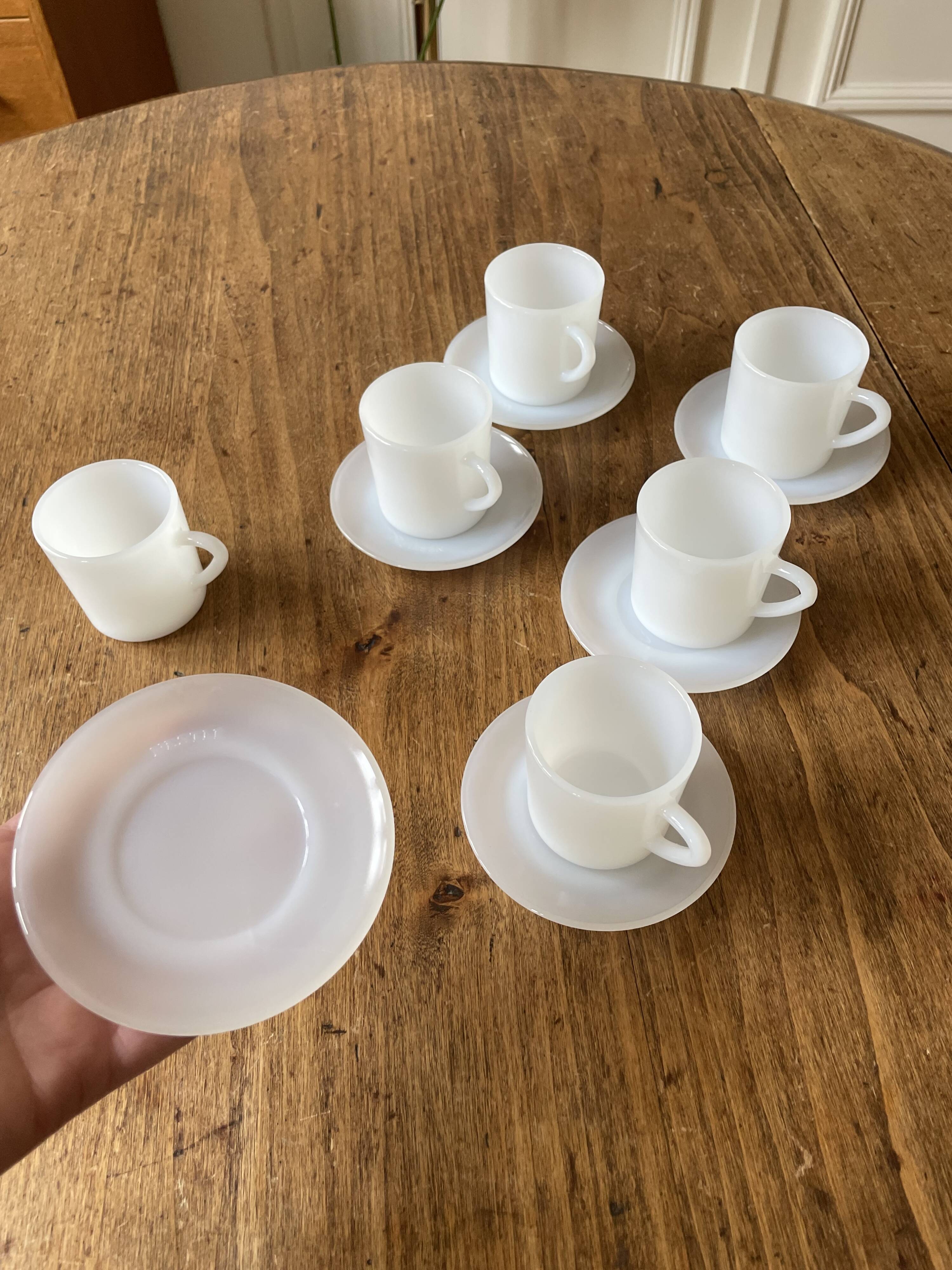 Espresso coffee cup service, Nestlé promotional items, in white glass.