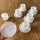 Espresso coffee cup service, Nestlé promotional items, in white glass.