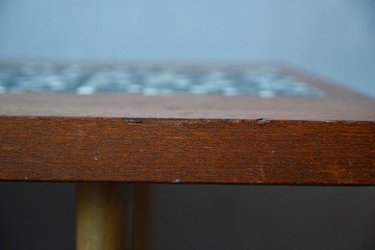 1970s coffee table with a tapered teak base and ceramic mosaic.