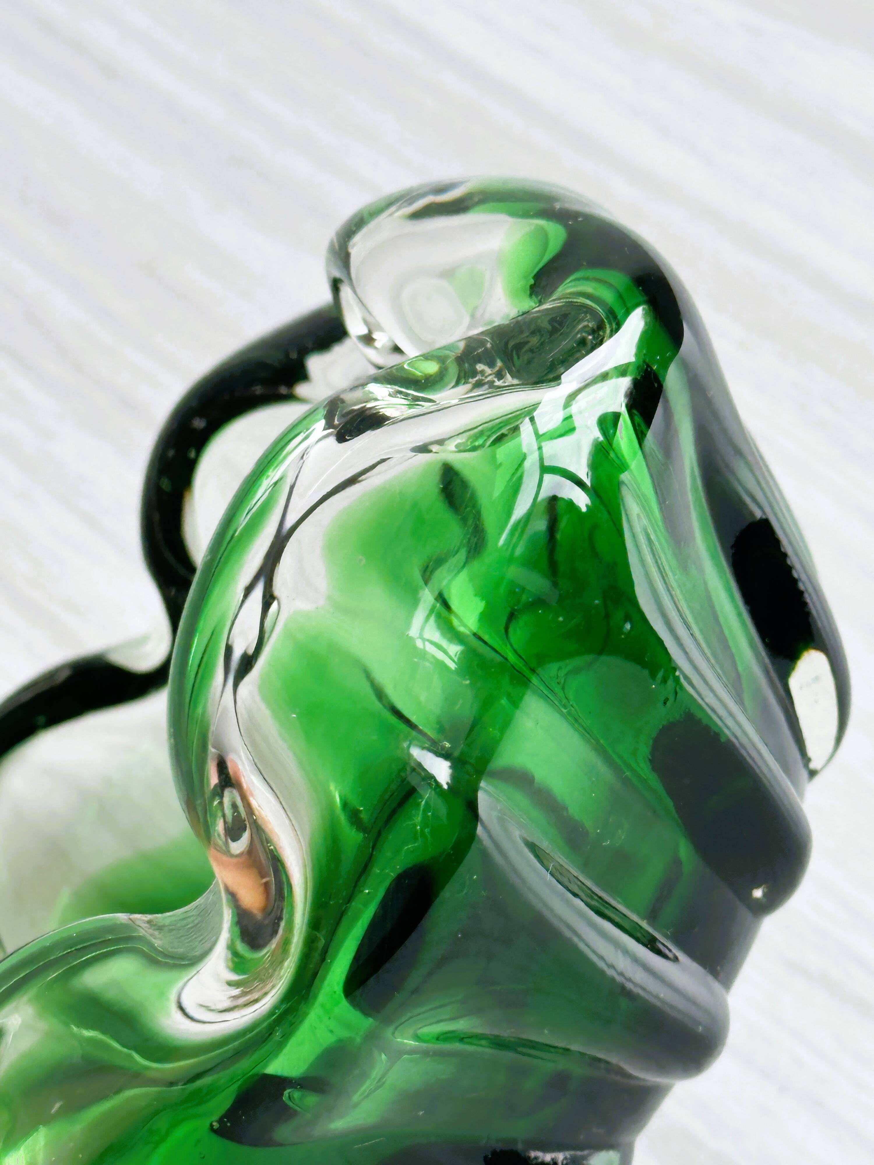 Translucent green ashtray.