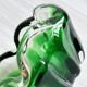 Translucent green ashtray.
