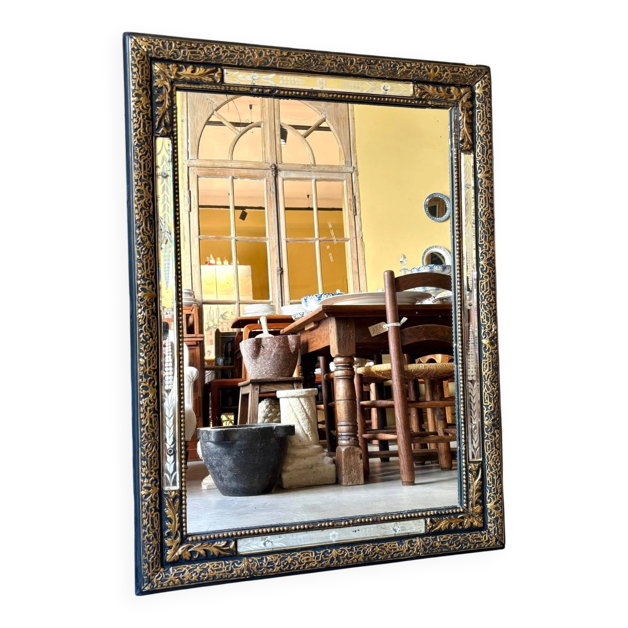 Rectangular Napoleon III mirror in moulded black and gold wood with engraved mirror decoration.