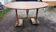 Oval table of grape harvesters from the Southwest in cherry wood