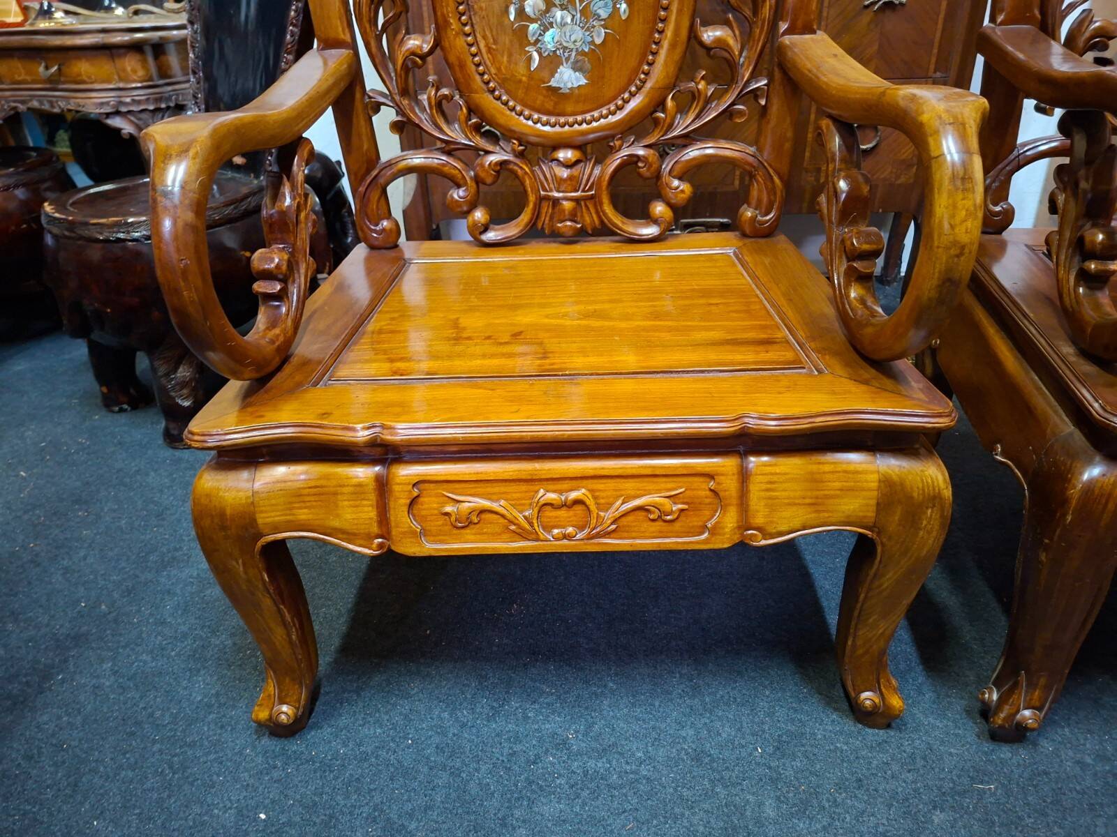 Pair of Asian armchairs in carved wood with mother-of-pearl inlays.