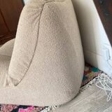 Vintage armchair reupholstered in boucle fabric.